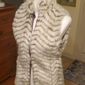 A fabulous cream/brown chevron faux fur vest